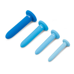 Four b-Vibe silicone dilators laid base-up showing size progression from large to small