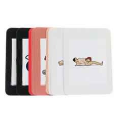Close-up of four color-coded card decks included in the 4Play couples game set