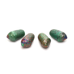 Four soft silicone eggs in green and multicolor swirl finish displayed in a row