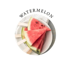 Fresh watermelon slices on popsicle sticks reflecting the gift set's natural watermelon scent