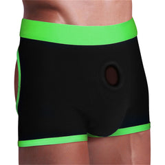 Front angle of black strap-on boxer shorts with neon green waistband and circular front O-ring opening