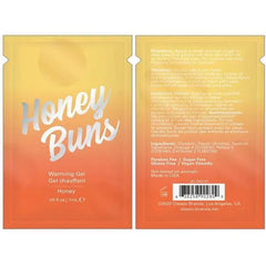 Front and back view of Honey Buns Warming Arousal Gel 1mL foil packet displaying full product details