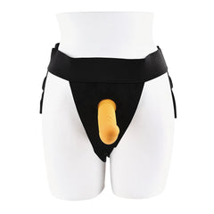 Front view of black strap-on harness with yellow silicone vibrating dildo on mannequin