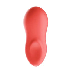 Front face of Touch X vibrator in coral, highlighting the smooth ergonomic dual-lobe silicone shape