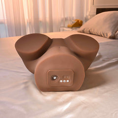 Front-facing base view of dark-tone stroker showing control module and sturdy flat-bottom design