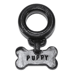 Front-facing view of Puppy Cockring showing flexible black ring and silver-tone bone charm