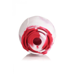 Front-facing view of rose-shaped suction stimulator tip showing circular air-pulse opening