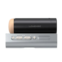 Front-facing view of Solace Pro stroker on silver base with control buttons visible