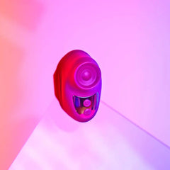 Close-up front view of Kisscool berry silicone stimulator showing circular tapping tip and buttons