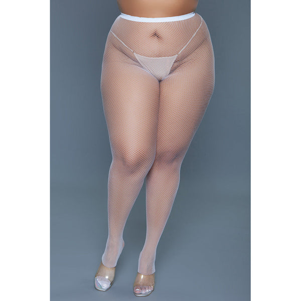 Front-on lifestyle view of white queen size fishnet pantyhose worn with clear heels