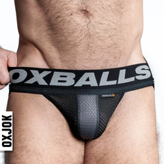 Close-up front view of OXBALLS AIRMESH jockstrap showing textured mesh pouch and wide elastic waistband