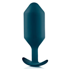 Close-up front view of Snug Plug 6 revealing the geometric faceted silicone body in deep teal