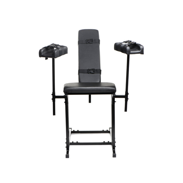 Front view of unoccupied Extreme Obedience Chair in upright position showing full frame and stirrups