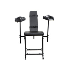 Front view of unoccupied Extreme Obedience Chair in upright position showing full frame and stirrups