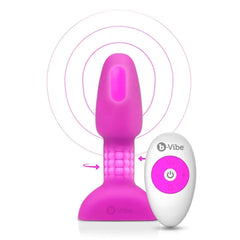 Fuchsia b-Vibe Rimming Plug Petite with remote control, showing rotating bead ring and wireless range