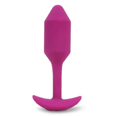 Fuchsia silicone weighted snug plug front view showing tapered tip and anchor base