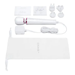 Full contents of Le Wand Petite box: massager, cord, adapters, storage bag, and user guides