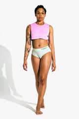 Full-length front view of model wearing mint Virtue rib briefs with pink crop top