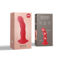 Fun Factory Bouncer rumbling dildo shown with front and back of coral pink retail packaging
