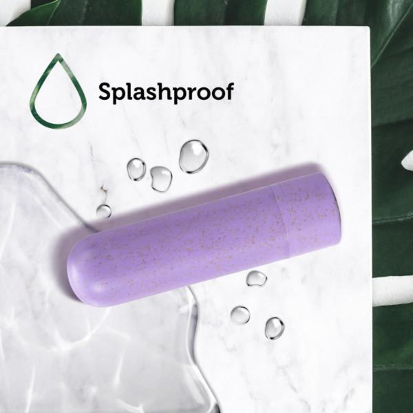 Gaia Eco Bullet lying on wet marble surface beside water droplets, splashproof