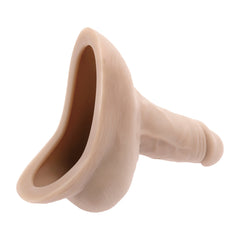 Gender X Stand to Pee packer in light skin tone, hollow base opening visible, soft TPE material