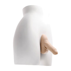 Gender X Stand to Pee packer worn on white mannequin torso, natural downward position