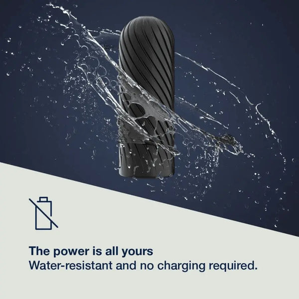 Ghost black silicone stroker surrounded by water splash, highlighting water-resistant cordless design