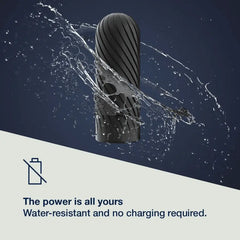 Ghost black silicone stroker surrounded by water splash, highlighting water-resistant cordless design
