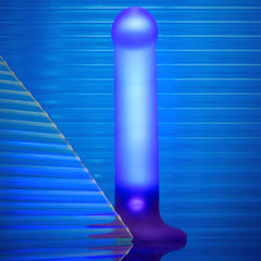 Close-up of Glow-LED Dildo illuminated in blue-purple tones with visible light button