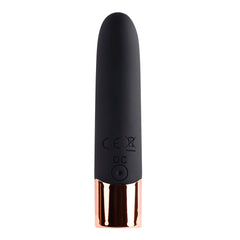 Close-up of The Gold Standard vibrator back panel with CE markings and DC charging port