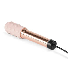 Grand Bullet vibrator connected to magnetic USB charging cable at base