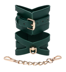 Close-up of green cutout cuff design with gold D-ring and detachable gold chain link