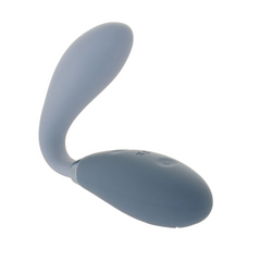 Grey silicone G-spot vibrator bent into a curved position showing flexibility