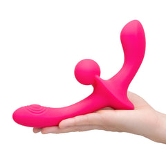 Hand cradling Double Tap horizontally showing both ends and central ball stimulator detail