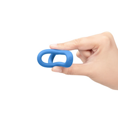 Hand demonstrating the dual-opening design of the blue silicone Snug Ring Tri-Sling