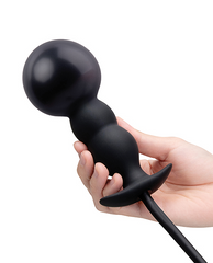 Hand displaying fully inflated b-Vibe anal plug, demonstrating expanded top bead size increase