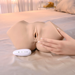 Hand gently resting on the side of the stroker beside a wireless remote, demonstrating realistic soft material flex