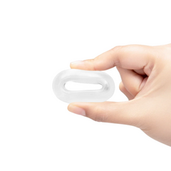 Hand gently squeezing the Stretch-Tech Choke cock ring, demonstrating its compressed flexibility