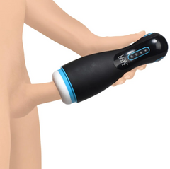 Hand gripping Auto Milker Extreme masturbator during use showing ergonomic size and control panel