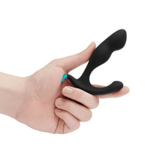 Hand gripping b-Vibe Rocker Plug at base demonstrating comfortable handling position