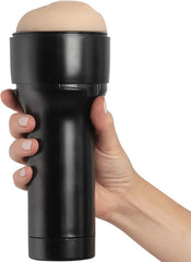 Hand gripping the black hard-shell casing of the Kiiroo Feel Generic male masturbator from above