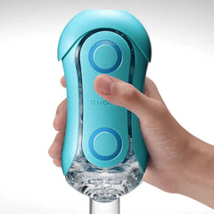Hand gripping the Flip Orb Ocean Blue, showing squeeze-control design in use