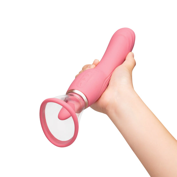 Hand gripping Le Wand Lick from G-spot end showing scale and suction head size