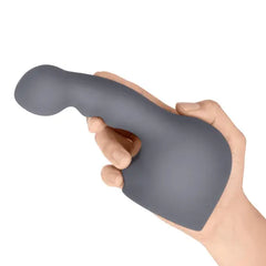 Hand gripping the Le Wand Ripple attachment upright, displaying curved tip detail