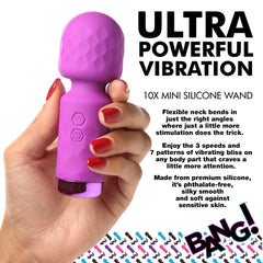 Hand gripping purple silicone wand vibrator highlighting flexible neck and phthalate-free material