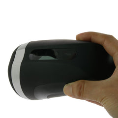 Hand gripping the Satisfyer Men Heat Vibration masturbator showing ergonomic size and side control panel