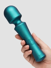 Hand gripping teal wand massager showing plus and minus intensity control buttons