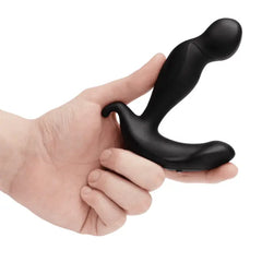 Hand holding b-Vibe 360 Plug upright to show compact insertable size and curved shape