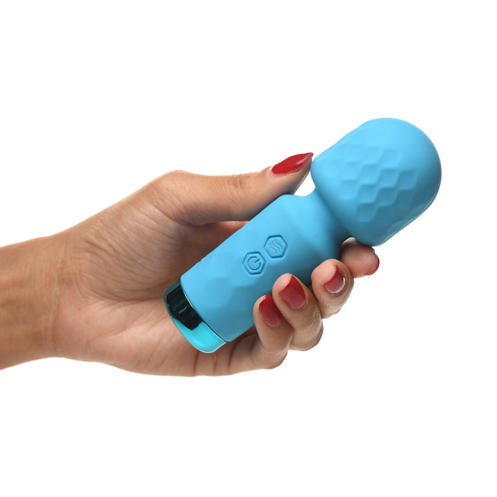 Hand holding the Bang! 10X Mini Wand Vibrator in sky blue silicone, front view