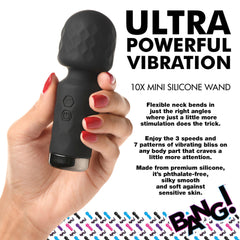 Hand holding black mini wand massager with flexible neck and textured silicone head
